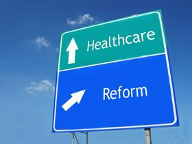 A sign says Healthcare, reform