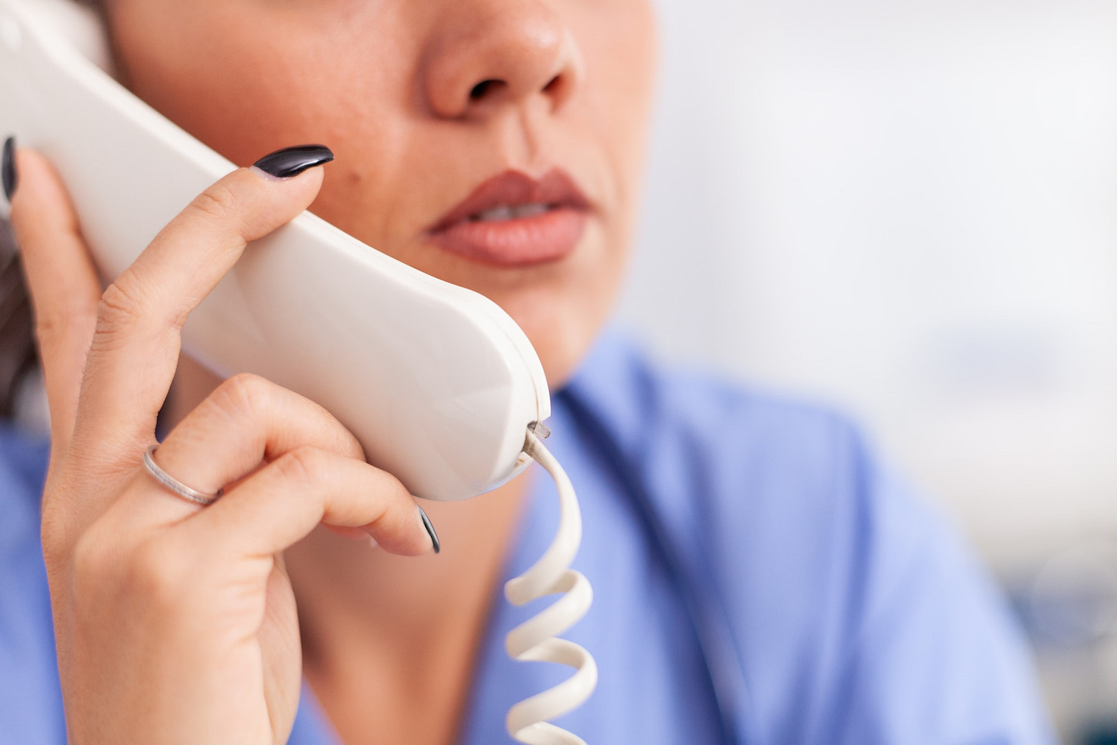Medical receptionist answering phone calls