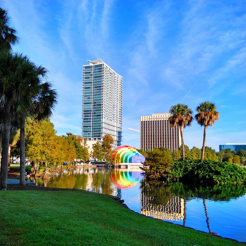 Landscape view of Lake Eola and the amphitheatre and buildings in downtown Orlando Florida on